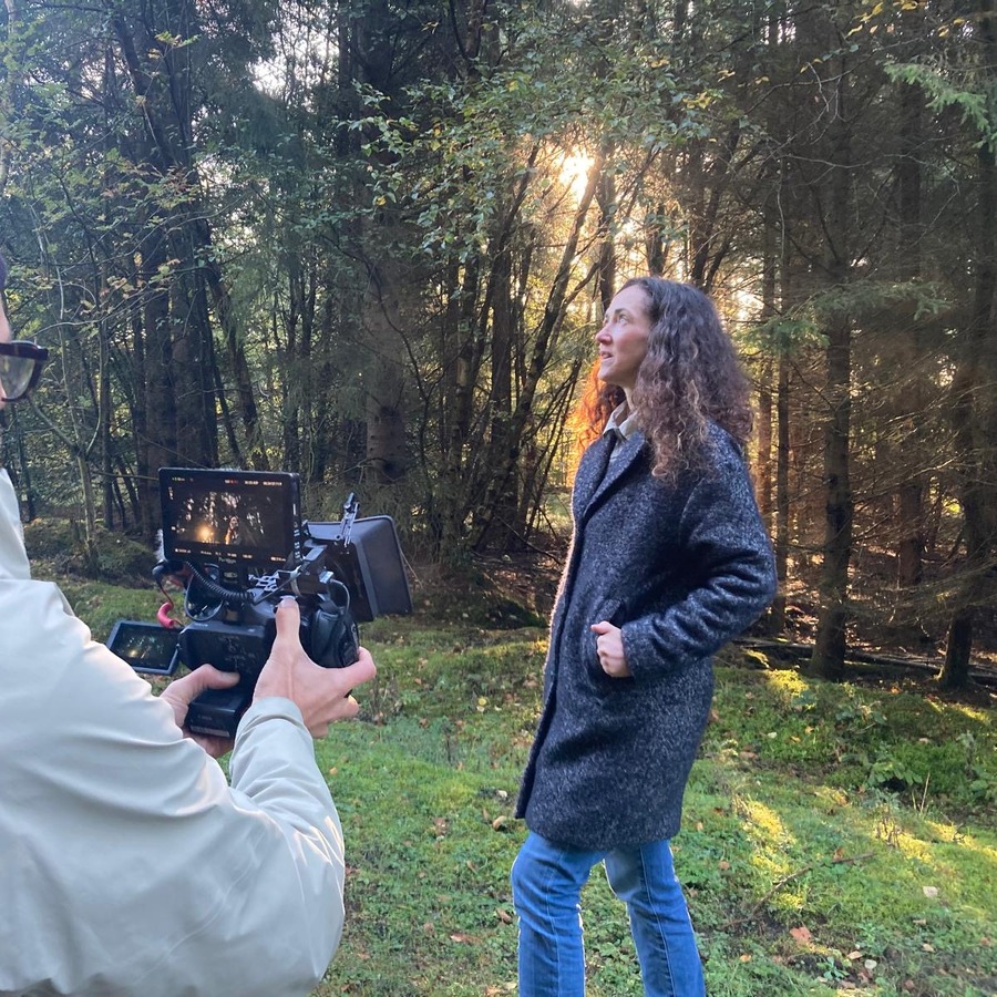 Melanie Challenger filmed in a sunlit forest for Part of Nature.